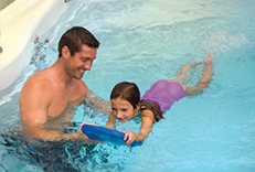 A family in a swim spa enjoying their time together