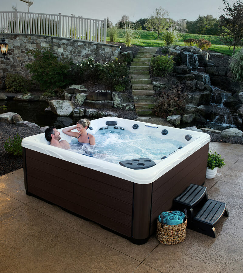 Stone steps and a waterfall create an outdoor sanctuary